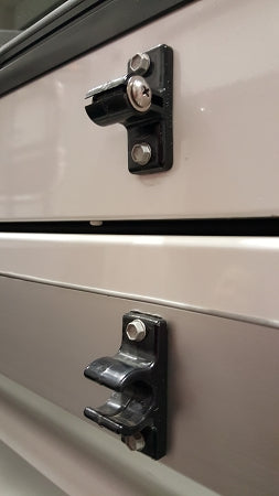 Adjustable Nylon Door Holder, shown mounted to trailer