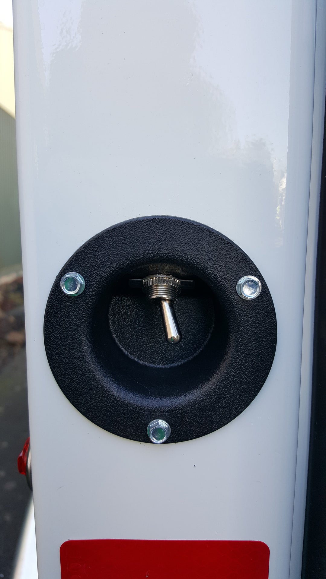 plastic switch cup with toggle switch installed