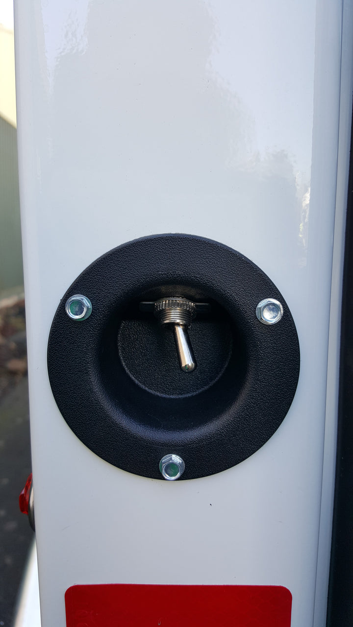 plastic switch cup with toggle switch installed