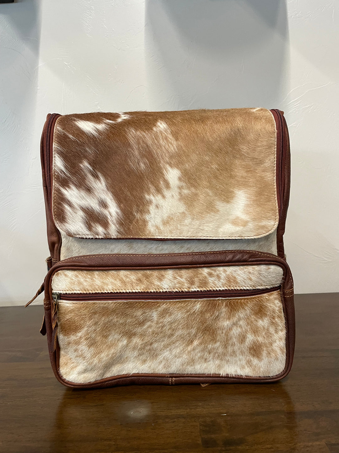 cowhide backpack brown and white