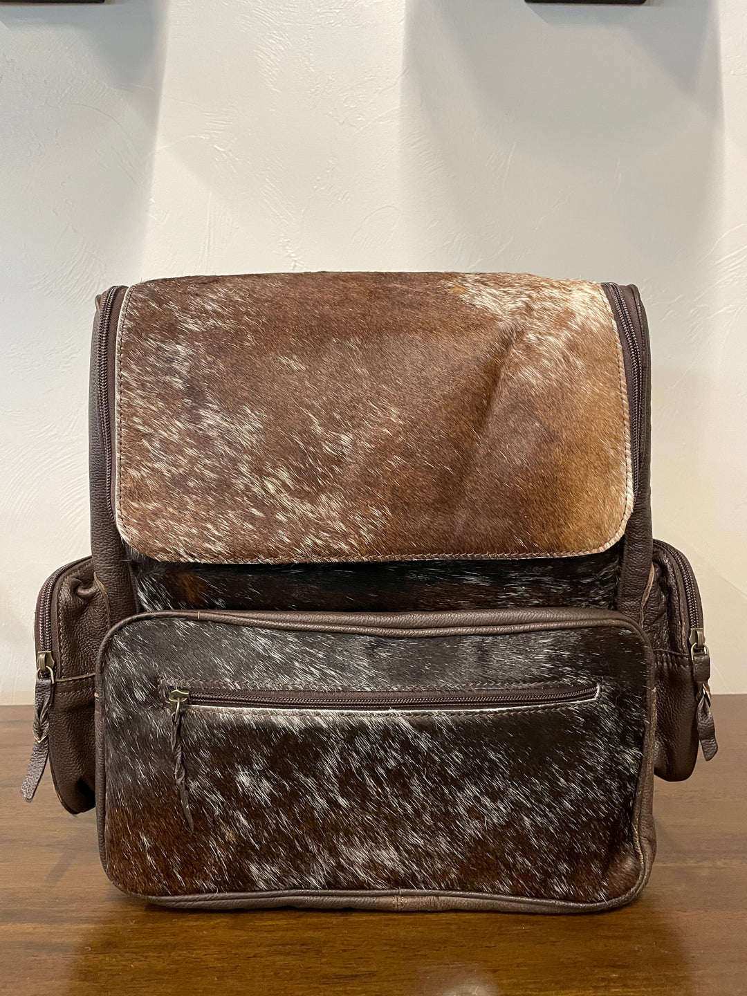 cowhide backpack dark brown