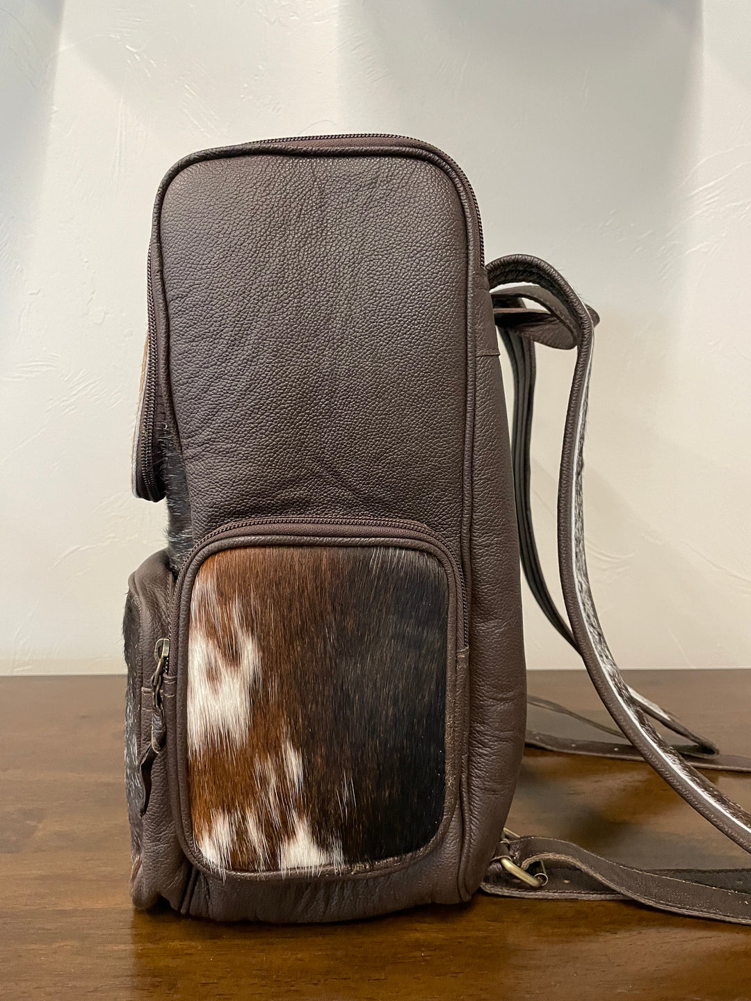 cowhide backpack dark brown