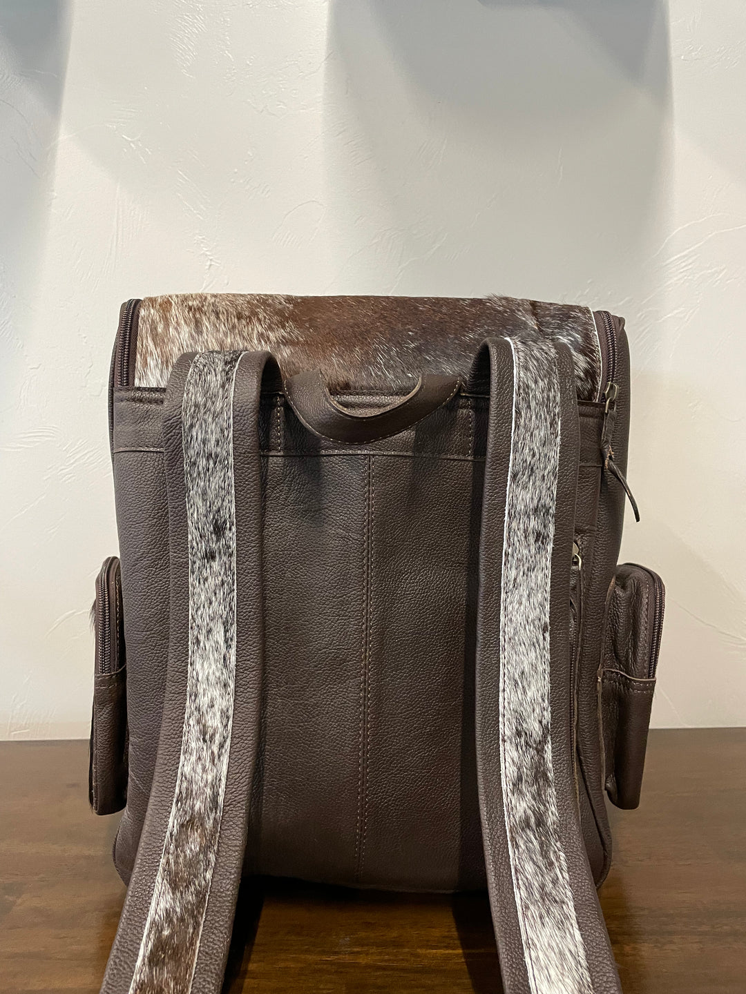 cowhide backpack dark brown