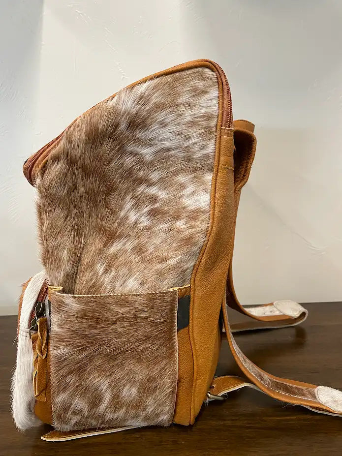 cowhide backpack tan and white