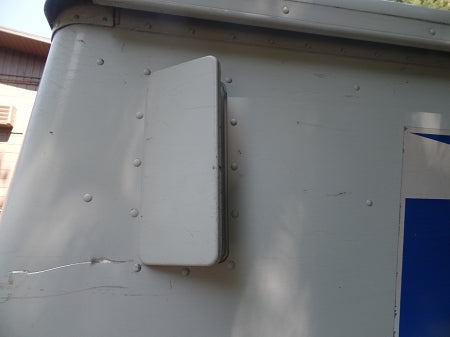 Low Profile Vent shown installed vertically on the sides of a USPS delivery truck; it can be opened in a forward or backward position for two types of ventilation. This truck has 4 of these vents mounted on it.